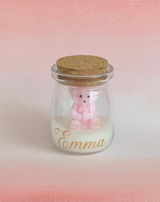 Pink teddy bear in a bottle